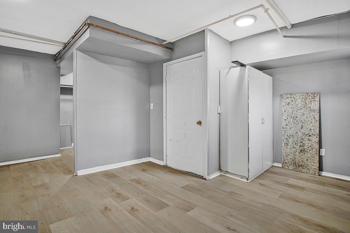 5204 Ivanhoe Avenue Baltimore, MD 21212 - Photo 28 of 38 a view of hallway with wooden floor