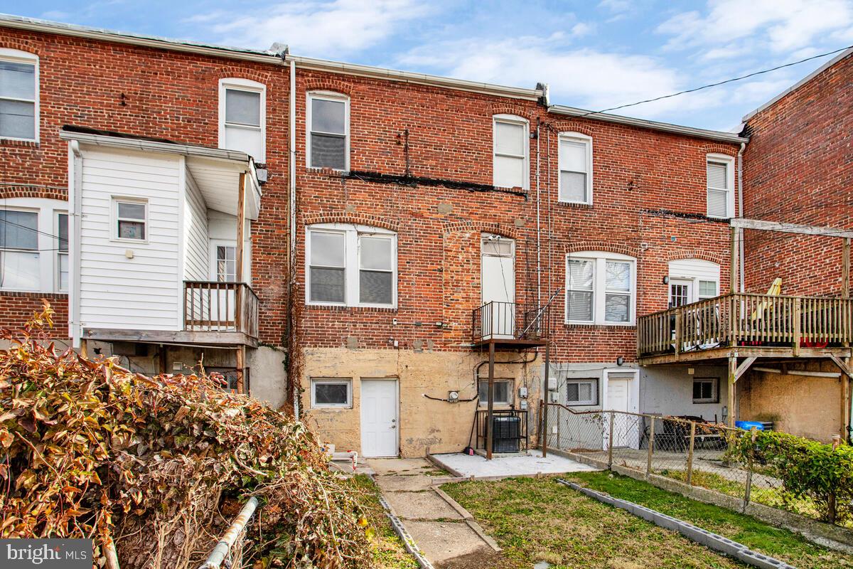 5204 Ivanhoe Avenue Baltimore, MD 21212 - Photo 34 of 38 a front view of a building with a garden