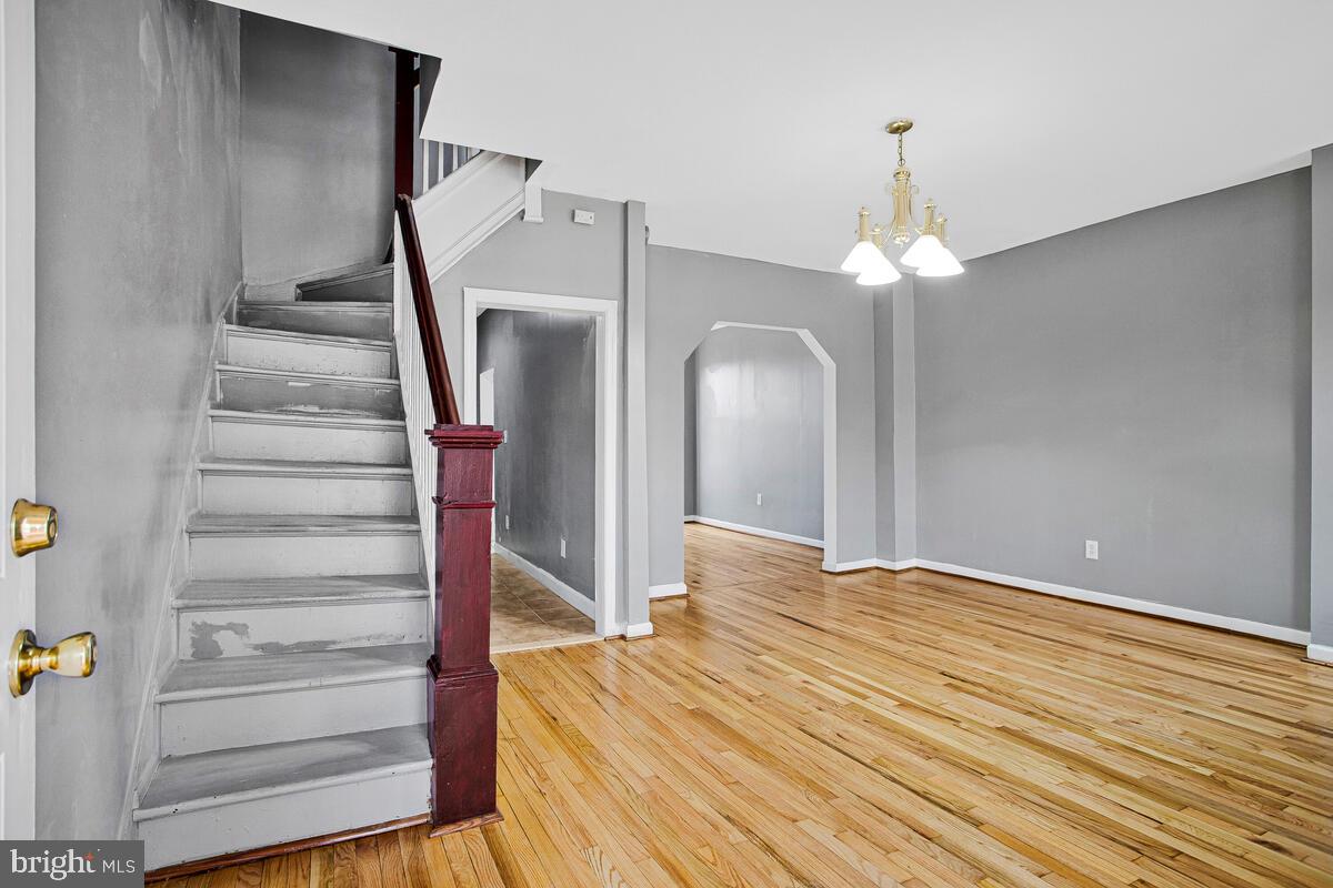 5204 Ivanhoe Avenue Baltimore, MD 21212 - Photo 4 of 38 a view of entryway and hall with wooden floor