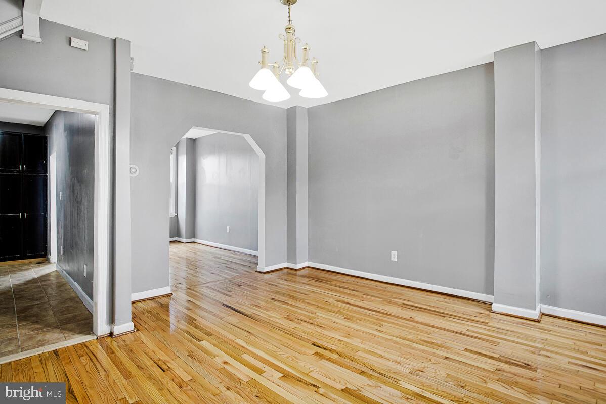 5204 Ivanhoe Avenue Baltimore, MD 21212 - Photo 6 of 38 a view of a room with wooden floor and staircase