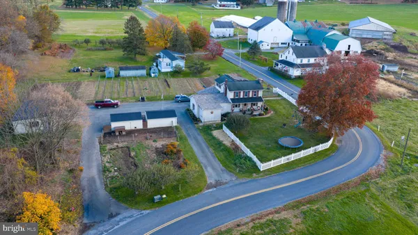 an aerial view of residential house with outdoor space and lake view