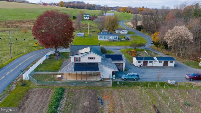 a view of a house with a yard and garage