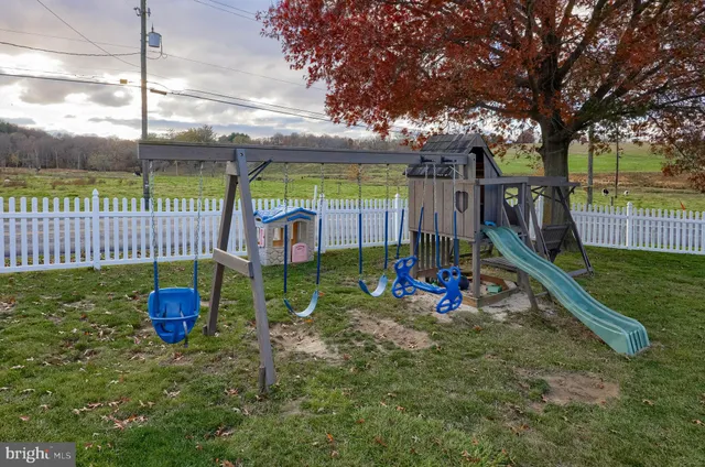 a bedroom with furniture and a flat screen tv