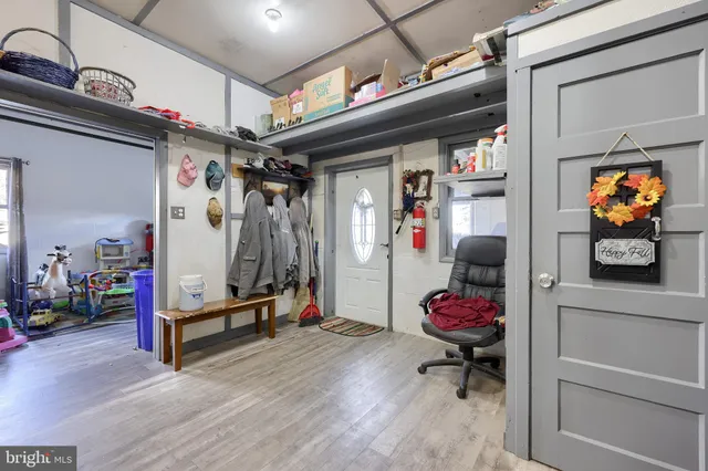 a kitchen with stainless steel appliances granite countertop a sink a stove and a wooden floors