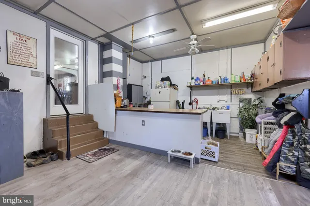a view of kitchen with furniture and wooden floor