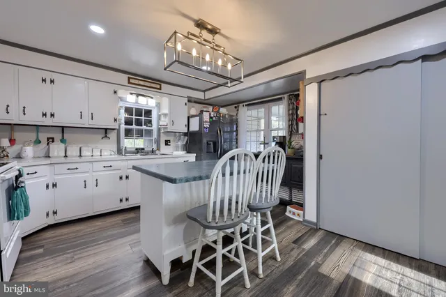 a room with furniture a rug and a window