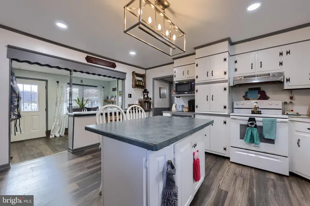 a bed room with a bed and a book shelf