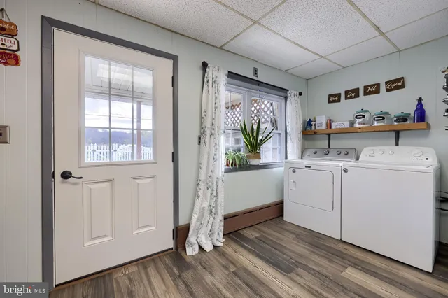a kitchen with a sink and a refrigerator