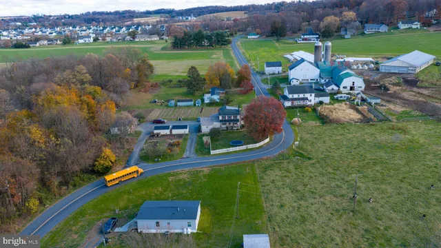an aerial view of a residential houses with outdoor space