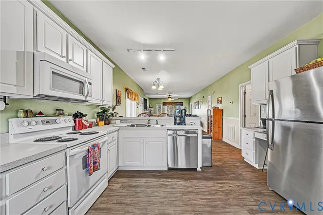 a kitchen with cabinets and stainless steel appliances