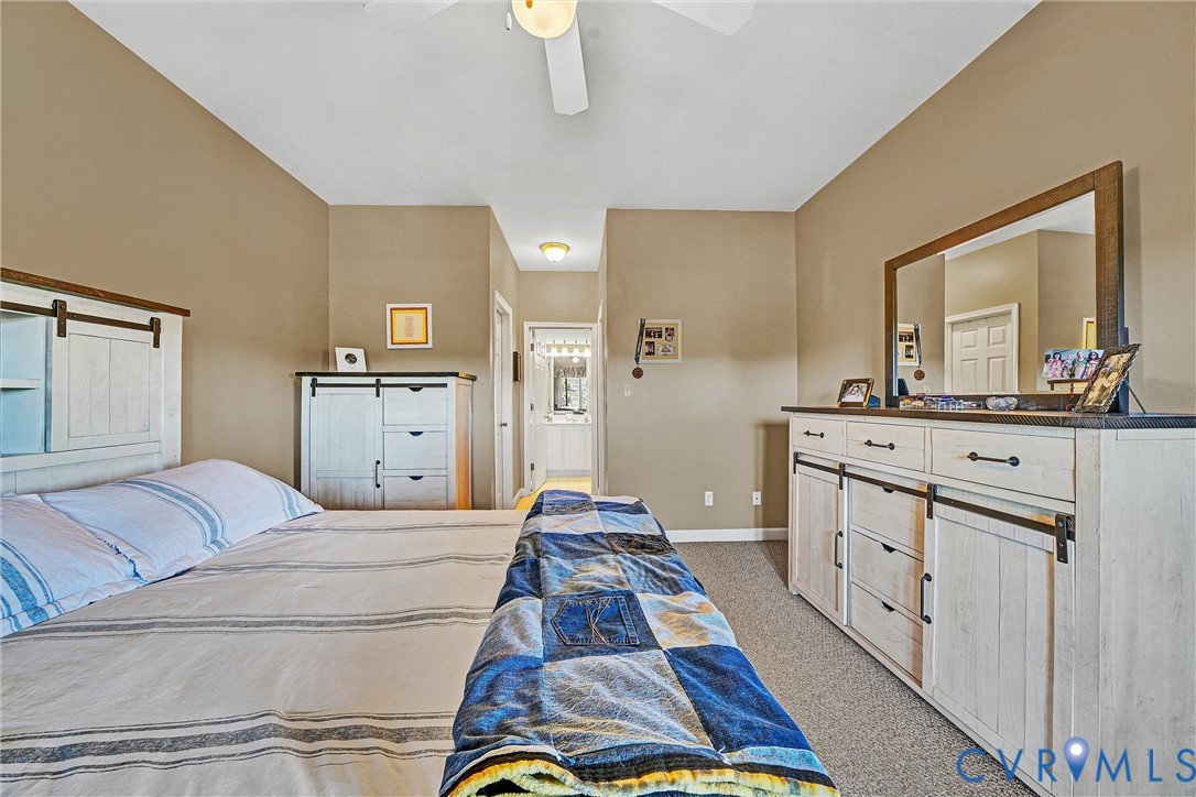 1103 Mariners Way Huddleston, VA 24104 - Photo 20 of 31 a bedroom with a bed and dresser with mirror
