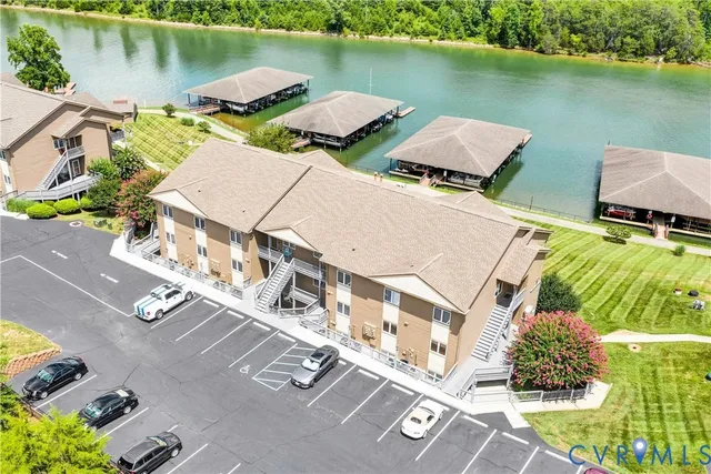 an aerial view of a house with a lake view