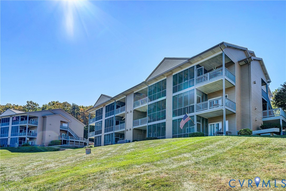 1103 Mariners Way Huddleston, VA 24104 - Photo 25 of 31 a view of building with a yard