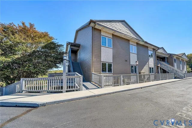 a front view of a house with a fence