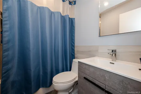 a bedroom with furniture and a wooden floor