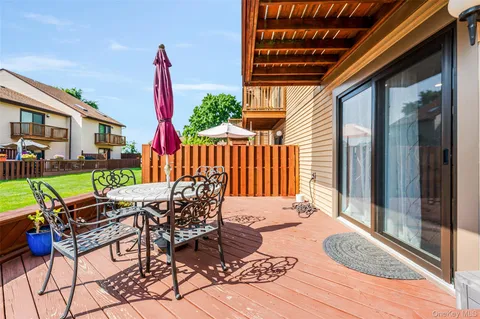 a bathroom with a sink a toilet and shower curtain