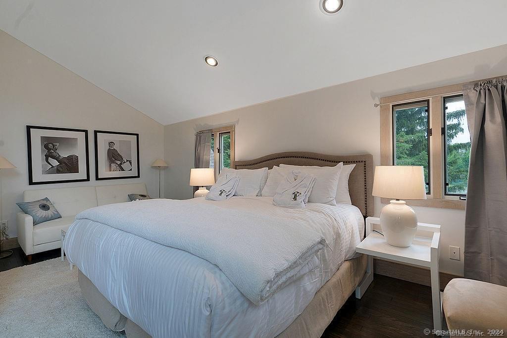 143 Melius Road Warren, CT 06754 - Photo 12 of 35 a bedroom with a large bed and a window
