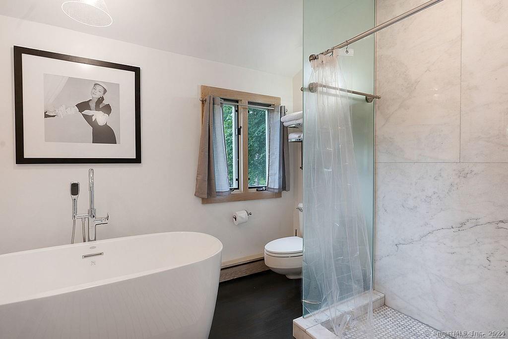 143 Melius Road Warren, CT 06754 - Photo 13 of 35 a bathroom with a sink and a bathtub