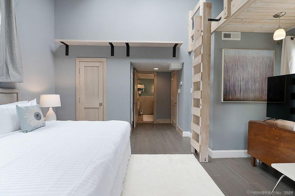 143 Melius Road Warren, CT 06754 - Photo 15 of 35 a bedroom with a bed and a couch