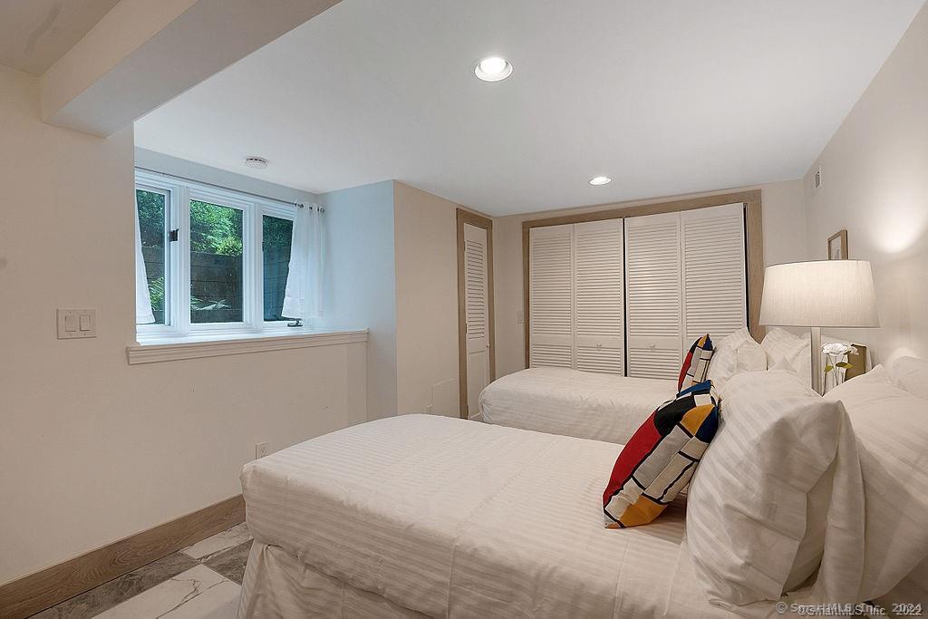 143 Melius Road Warren, CT 06754 - Photo 18 of 35 a bedroom with a bed and a window