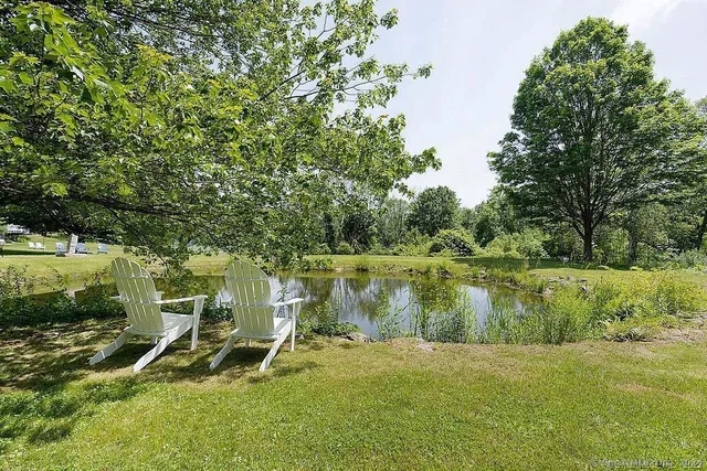 a view of a swimming pool with a yard