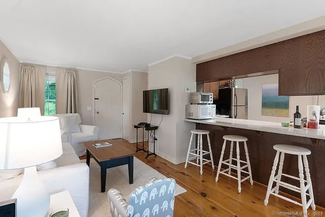 a kitchen with a table and chairs in it