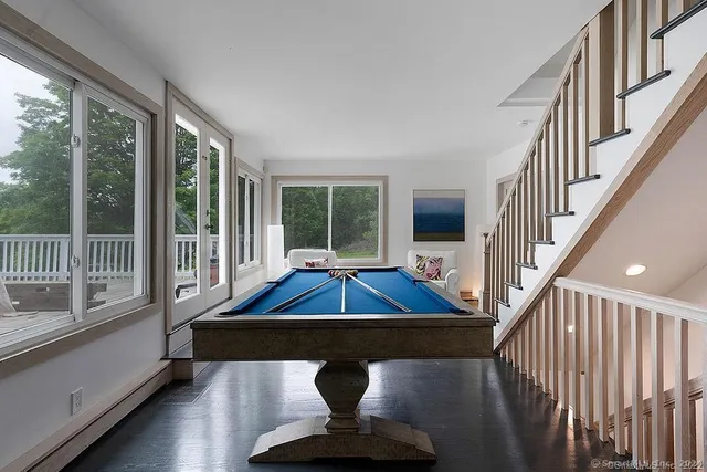 a kitchen with a sink counter top space appliances and cabinets