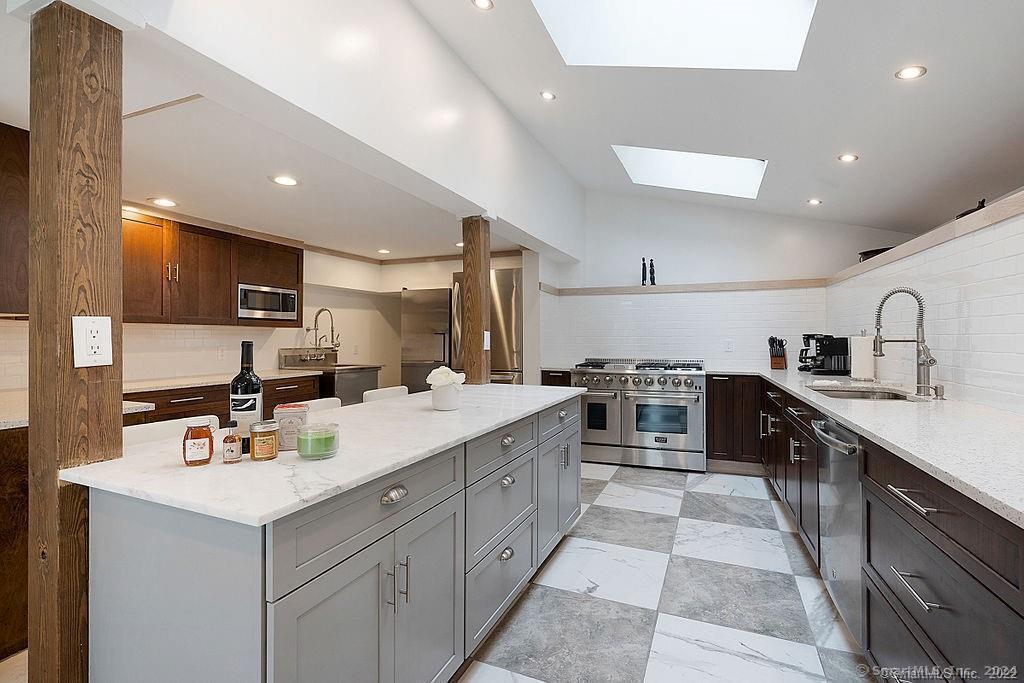 143 Melius Road Warren, CT 06754 - Photo 9 of 35 a kitchen with a sink counter top space appliances and cabinets