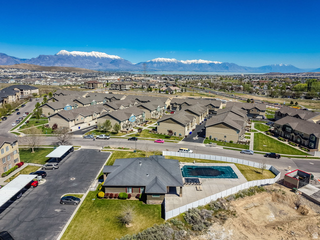 8215 Clear Rock Road, Unit 12 Eagle Mountain, UT 84005 - Photo 25 of 38 Expansive residential community featuring a variety of multi-story homes and townhomes, complemented by a prominent community swimming pool