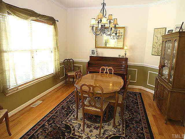 Formal dining with hardwood floors and detailed trim. Welcome home! Other