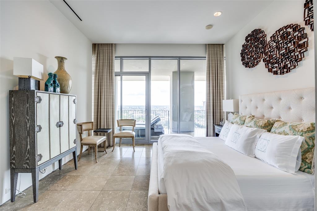 1717 Arts Plaza, Unit 1808 Dallas, TX 75201 - Photo 16 of 30 Bedroom featuring access to outside and multiple windows