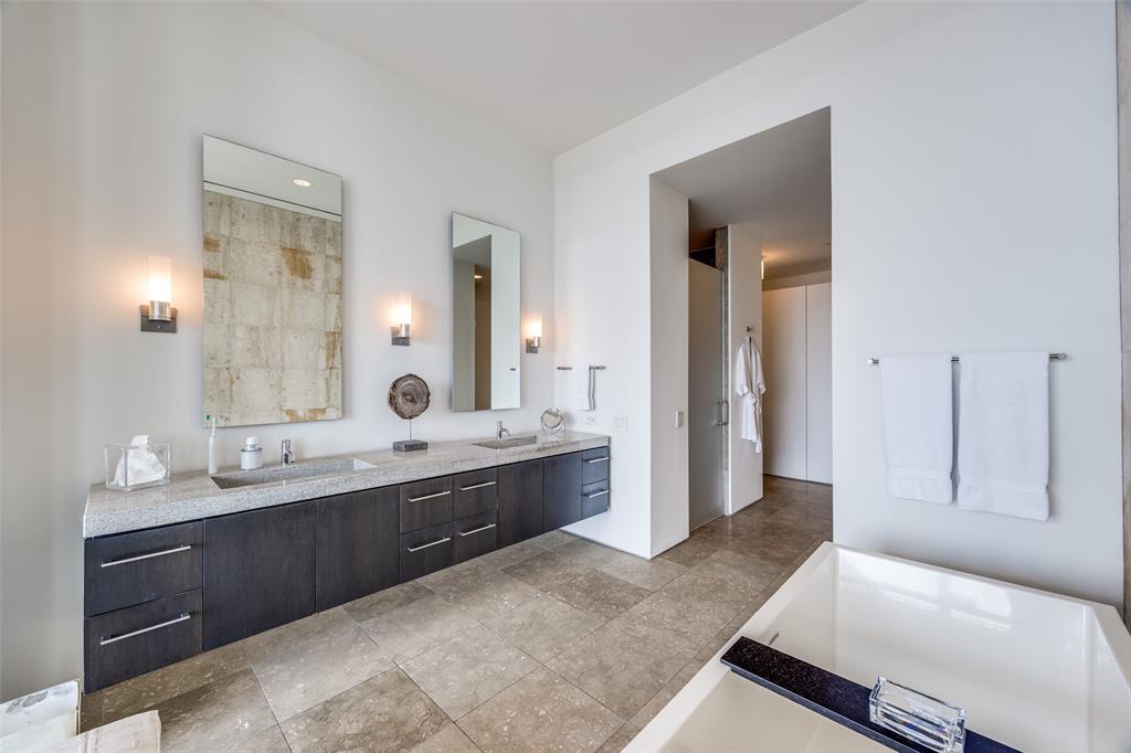 1717 Arts Plaza, Unit 1808 Dallas, TX 75201 - Photo 21 of 30 Bathroom with double vanity and a tub