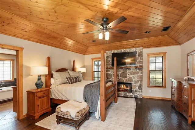 a bedroom with furniture and wooden floor