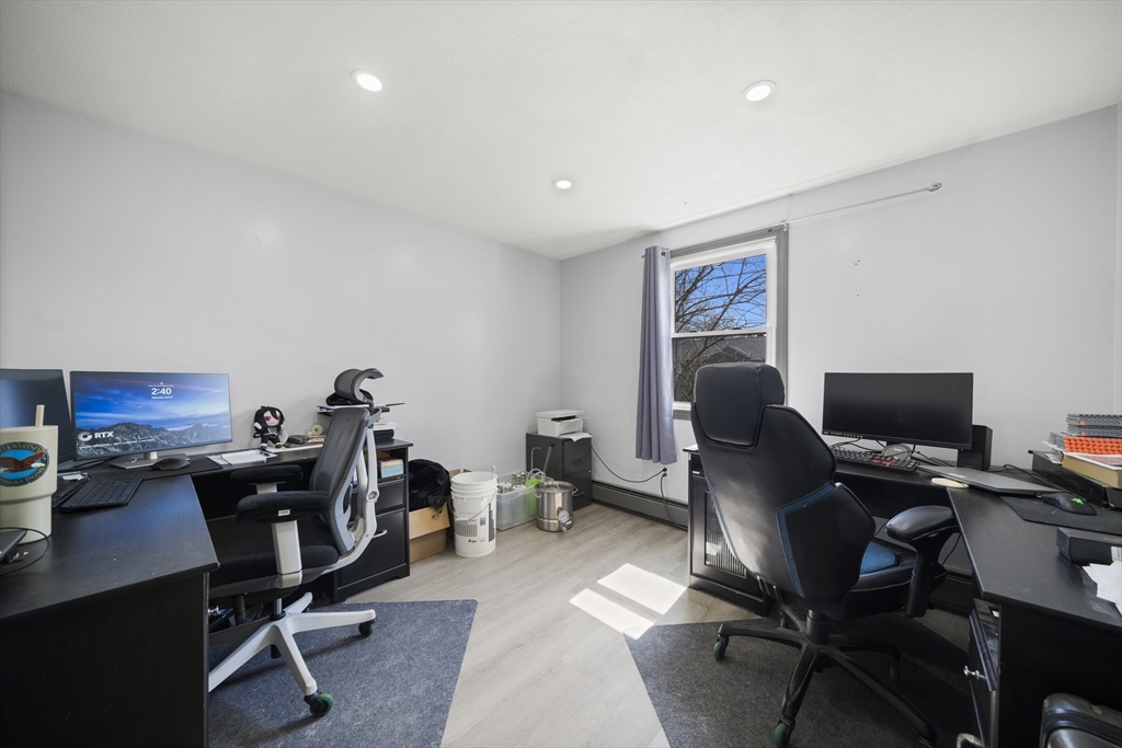 183-185 Middle Street Springfield, MA 01104 - Photo 14 of 27 a view of a workspace with furniture and a window