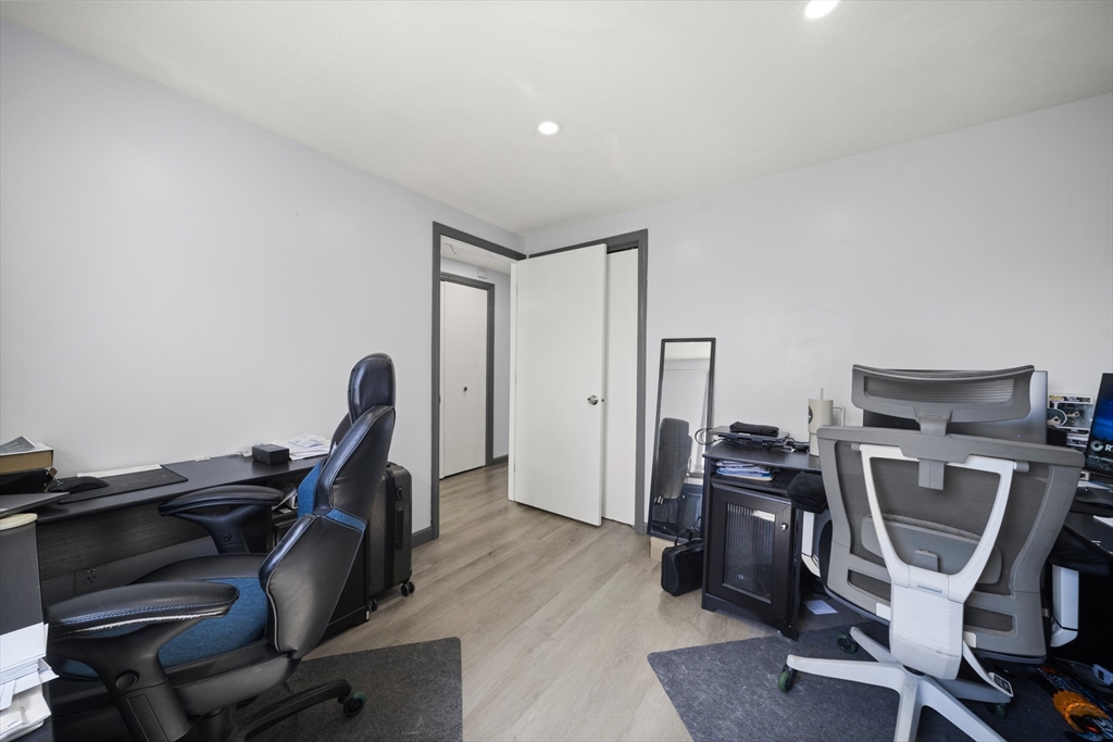 183-185 Middle Street Springfield, MA 01104 - Photo 15 of 27 a view of a workspace with furniture and wooden floor