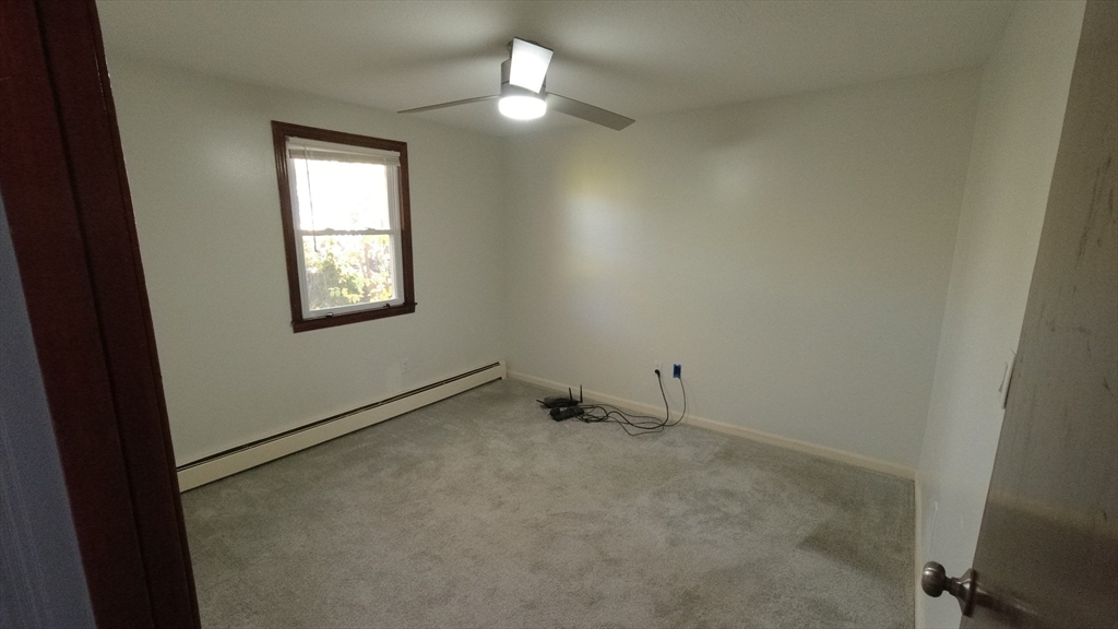 183-185 Middle Street Springfield, MA 01104 - Photo 26 of 27 an empty room with a window