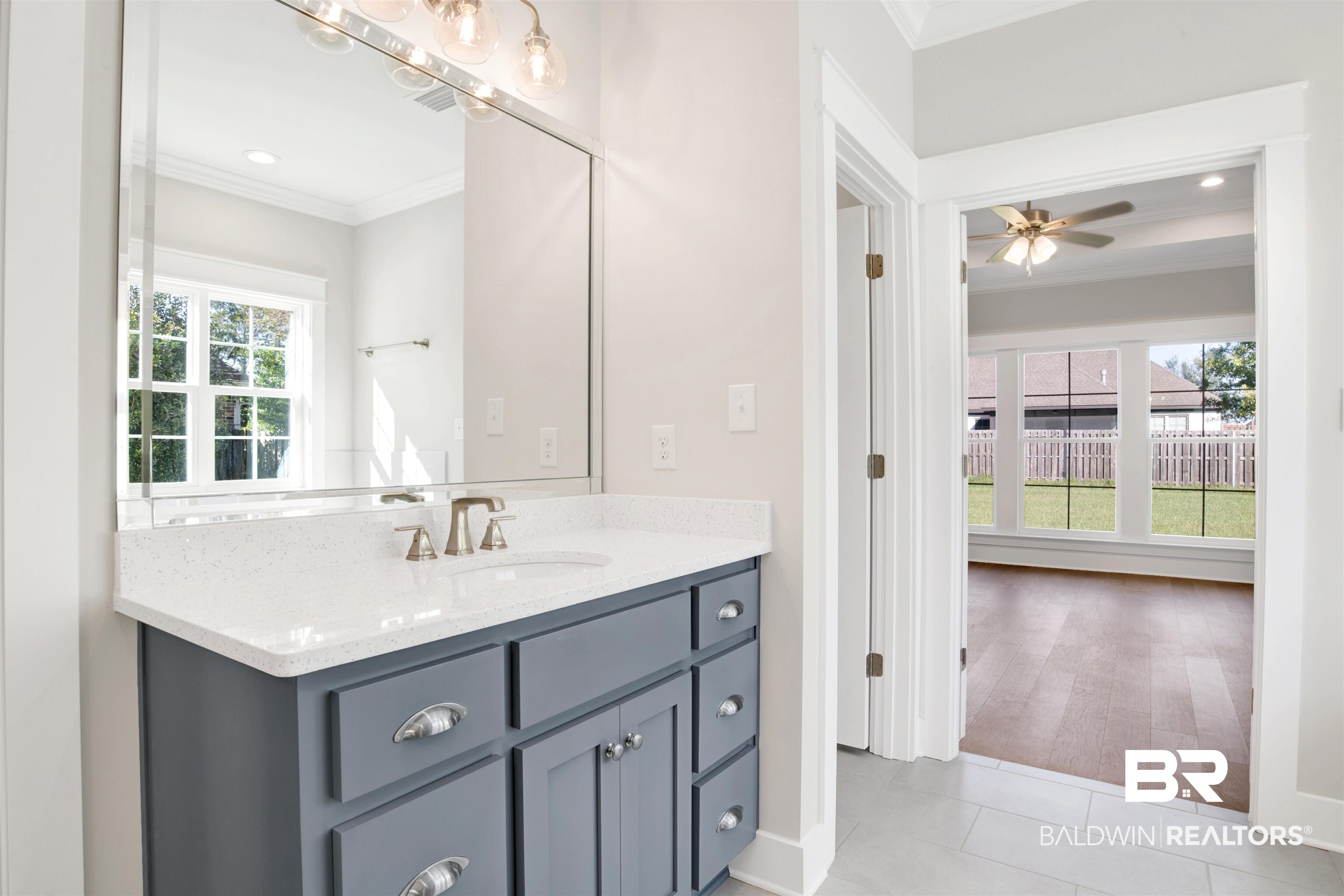 9687 Widgeon Court Daphne, AL 36526 - Photo 20 of 40 Bathroom featuring tile patterned flooring, vanity, ceiling fan, and ornamental molding