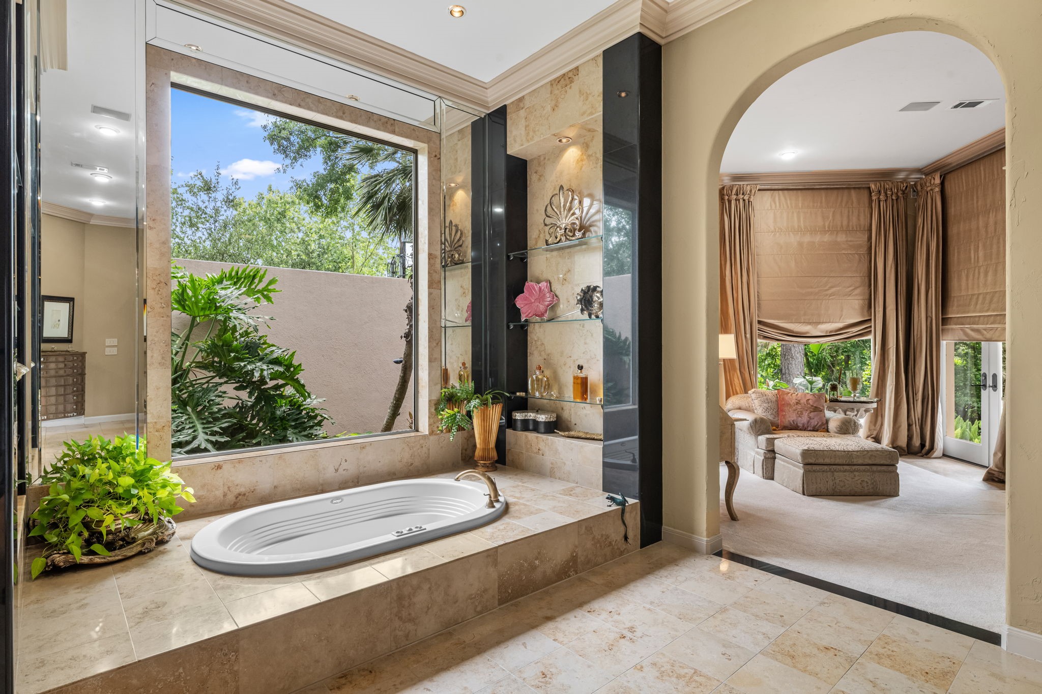 6 Mott Lane Houston, TX 77024 - Photo 22 of 50 Luxurious primary bath designed for relaxation, featuring a soaking tub with tranquil garden views.
