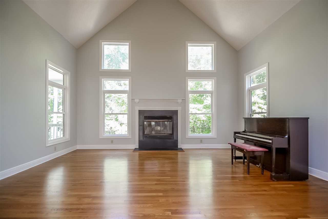 12925 Ghoston Road Wake Forest, NC 27587 - Photo 11 of 24 Soaring vaulted ceiling. Wood burning fireplace. Hardwoods. Living Room