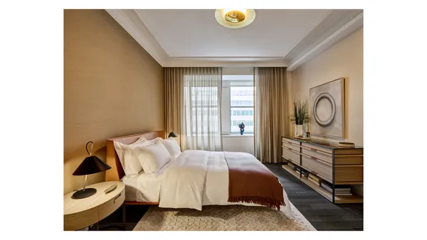a bedroom with a bed and cabinets