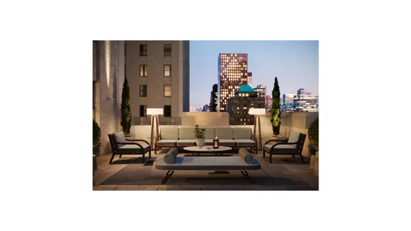 a living room with furniture and a dining table