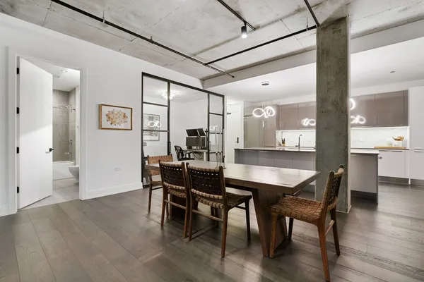 a dining room with furniture and wooden floor