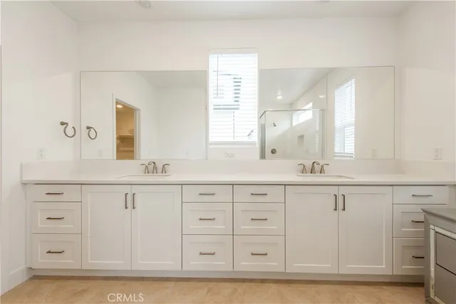a bathroom with a sink a vanity and a mirror