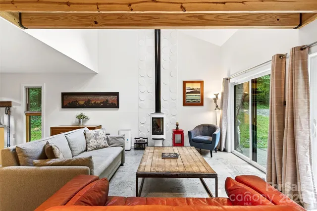 a dining room with furniture and a flat screen tv