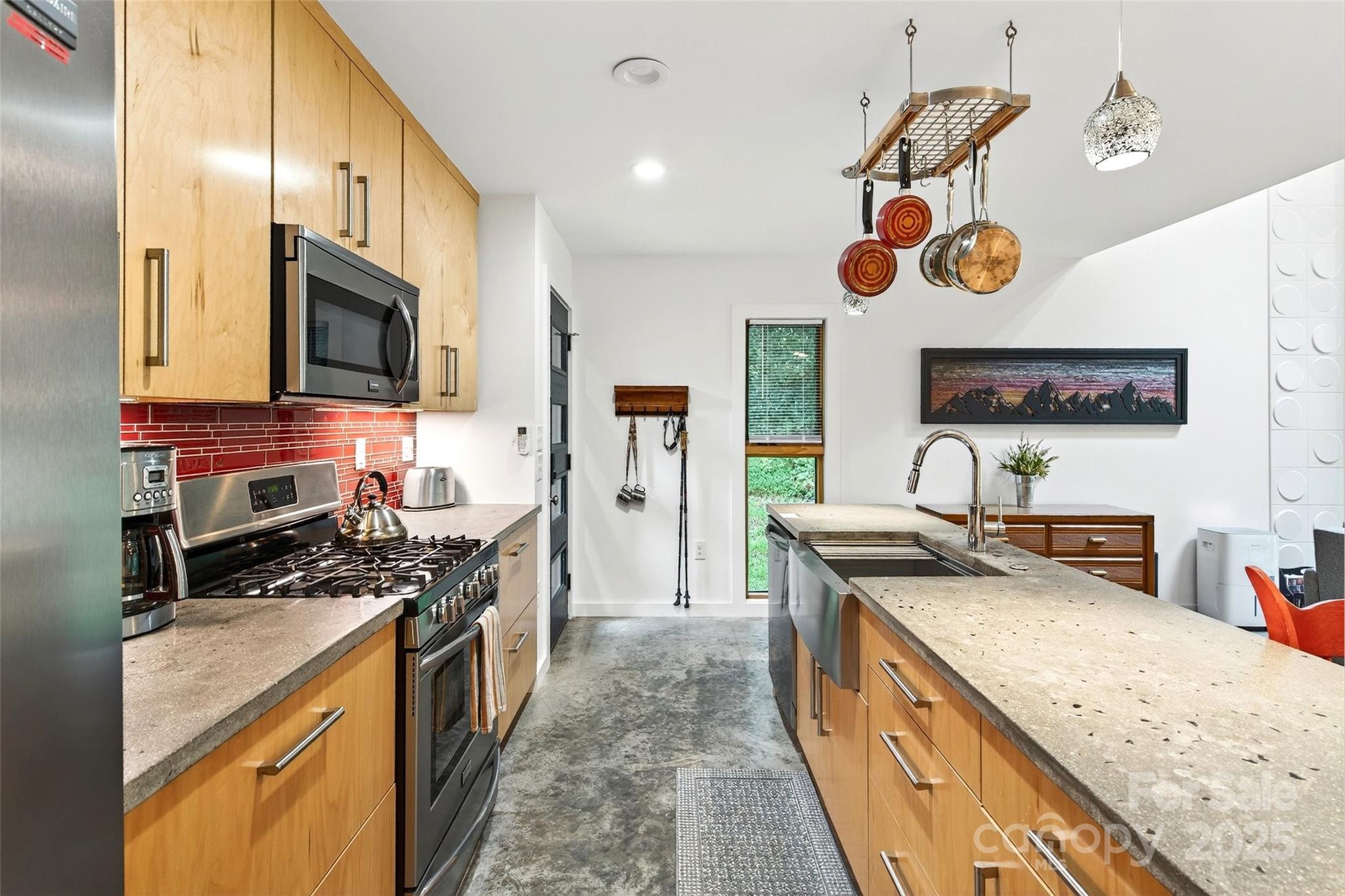 450 Lakey Gap Road Black Mountain, NC 28711 - Photo 16 of 48 a kitchen with stainless steel appliances granite countertop a stove and a sink