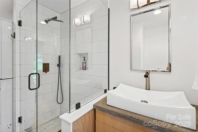 a view of a storage and utility room with a washer dryer