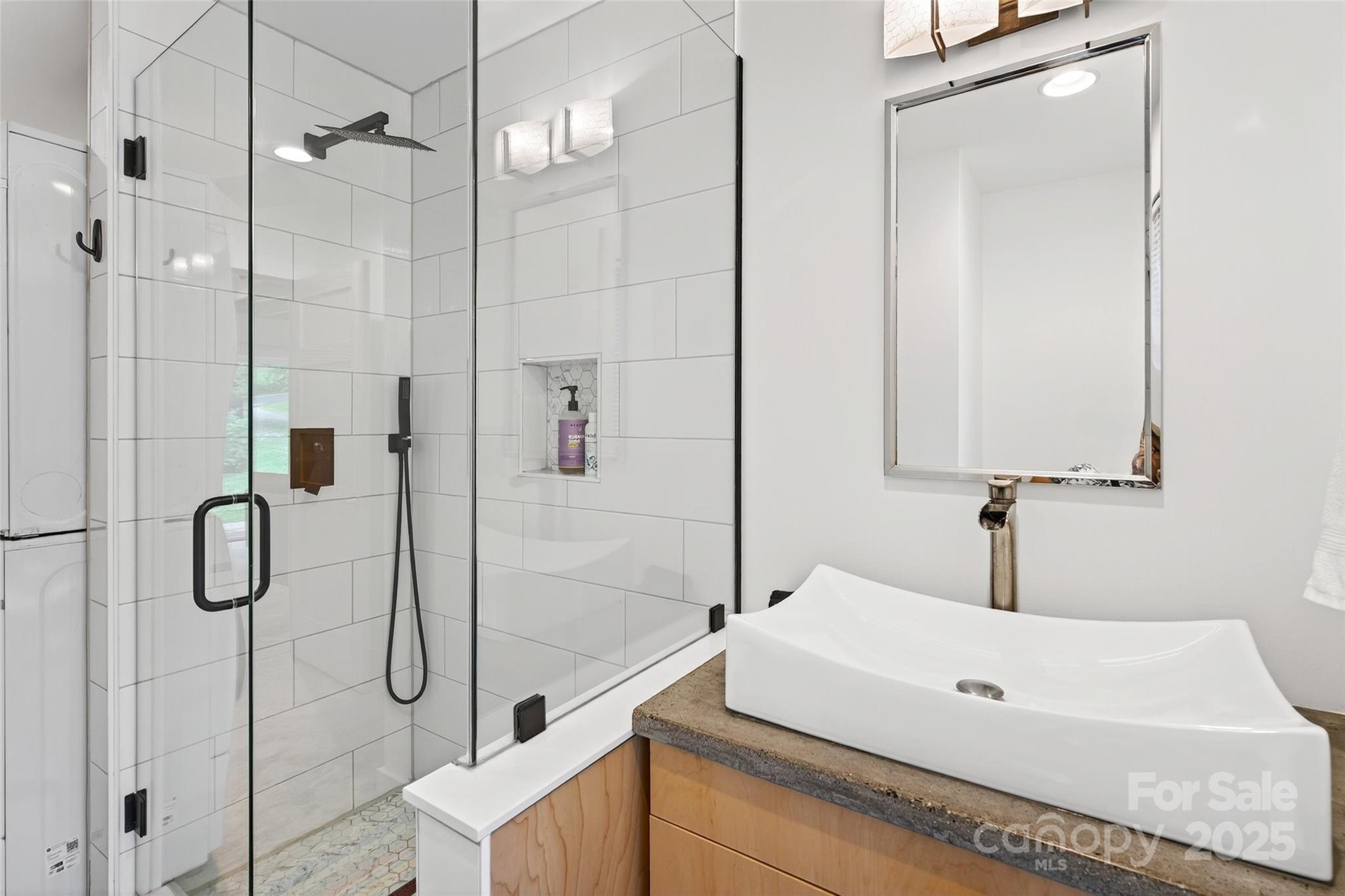 450 Lakey Gap Road Black Mountain, NC 28711 - Photo 19 of 48 a bathroom with a sink and a mirror