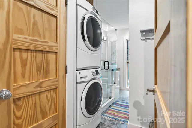 a view of staircase with wooden floor and white walls