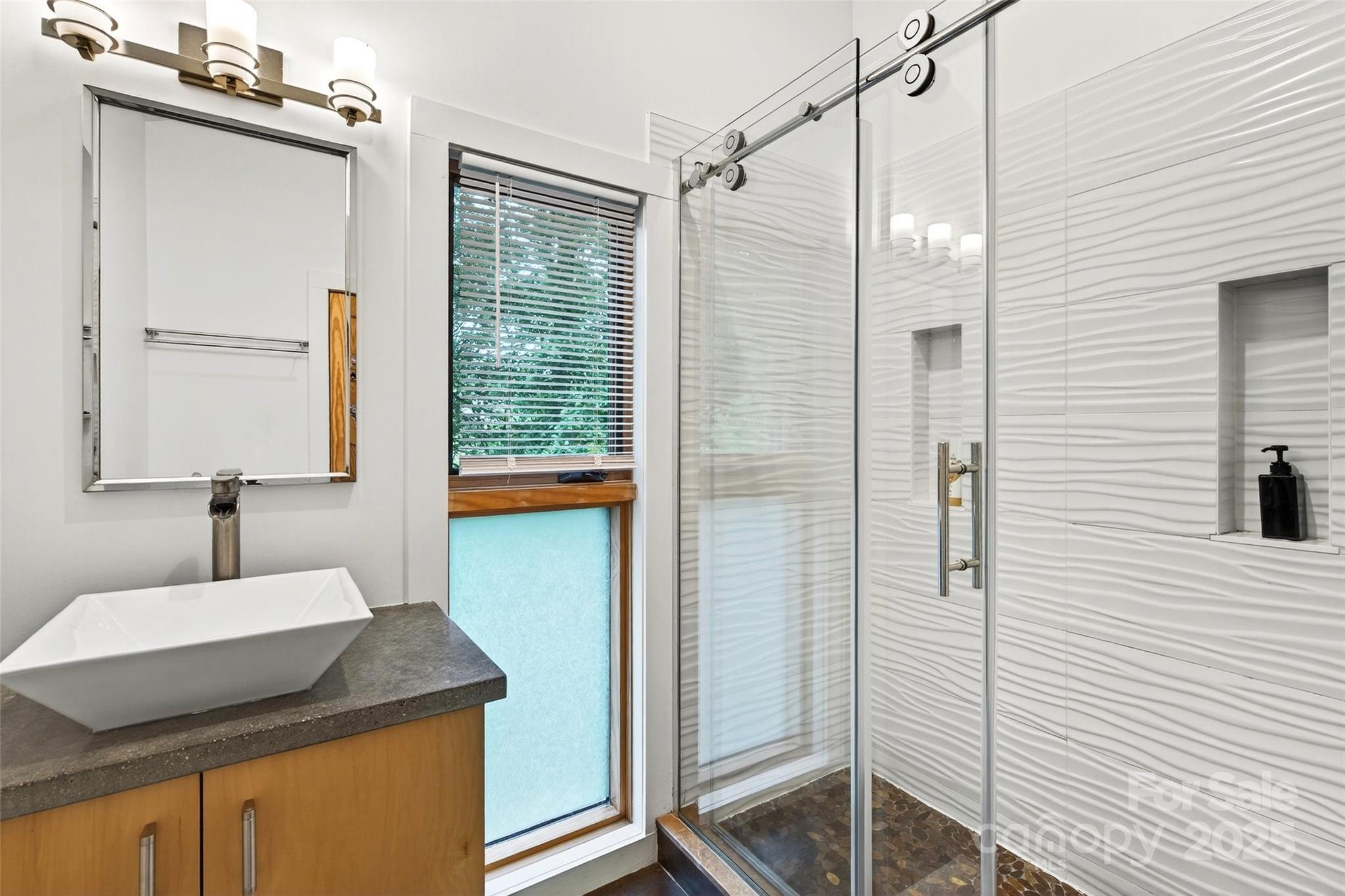 450 Lakey Gap Road Black Mountain, NC 28711 - Photo 25 of 48 a bathroom with a granite countertop sink and a mirror