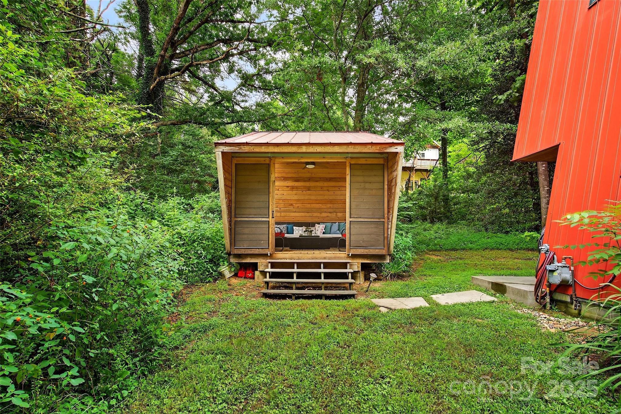450 Lakey Gap Road Black Mountain, NC 28711 - Photo 32 of 48 a view of a backyard with a garden